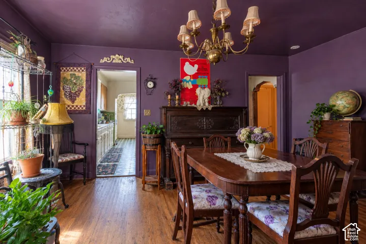 Hardwood flooring and an ornate brass chandelier  (Photo has been virtually decluttered)