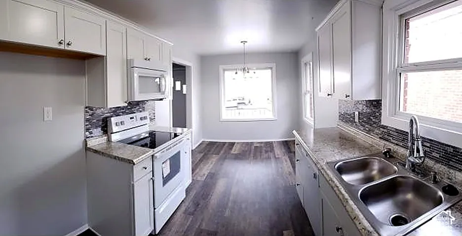 Upper unit kitchen looking toward the dining area.