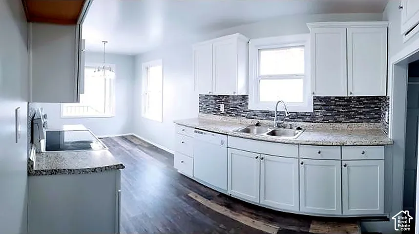 Upper unit kitchen. Granite counters and full cabinetry, updated in 2018.