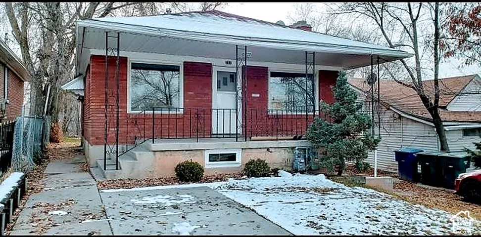 Concrete driveway with two uncovered parking spaces.