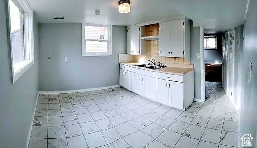 Lower unit kitchen. Private at-grade walkout entrance.