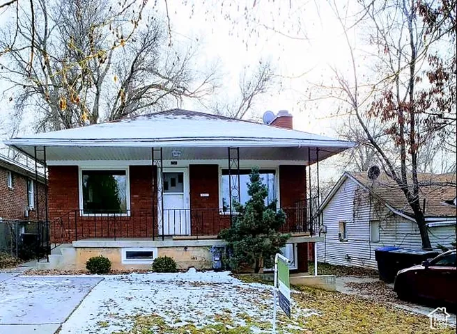 Front elevation from 30th Street. All brick with an asphalt shingle roof.