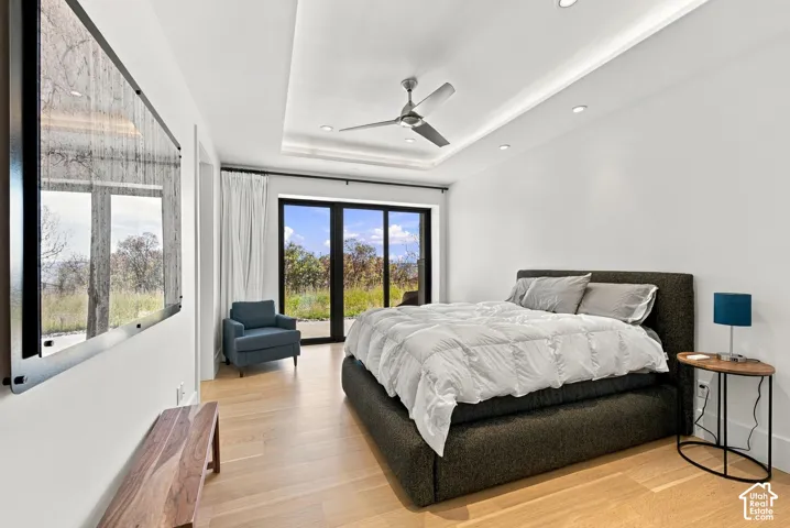 First quest quarters bedroom offers patio access to enjoy the sunrise.