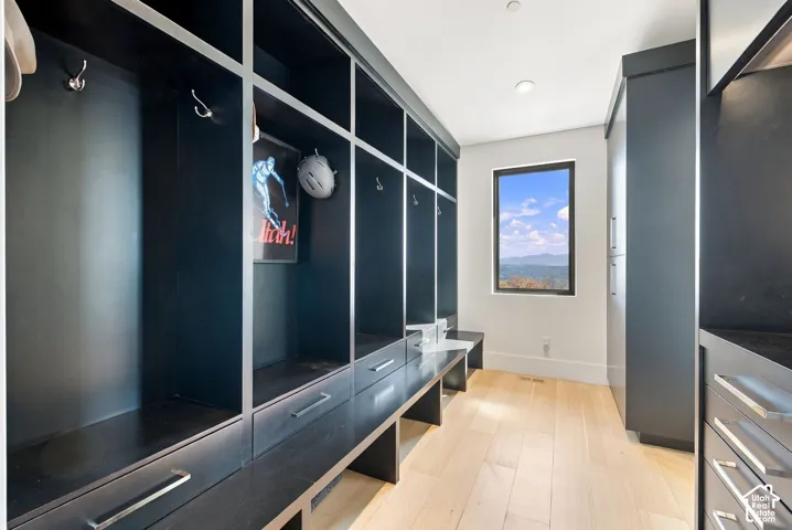 Mudroom near main garage features abundant storage