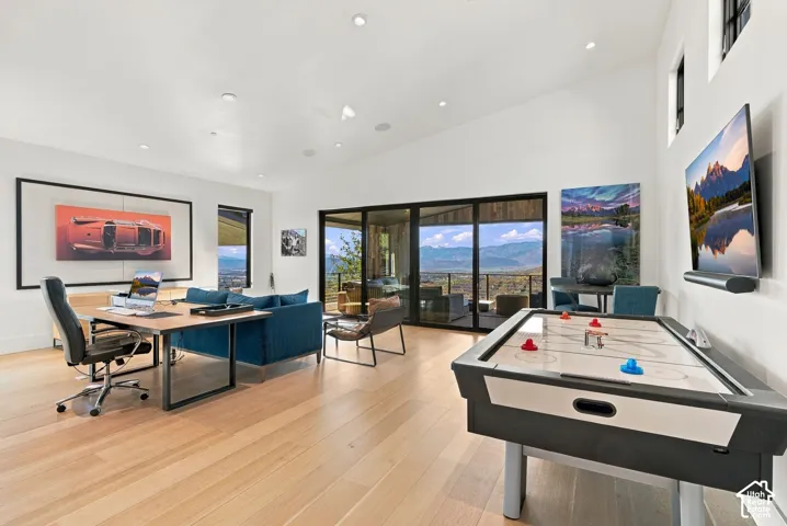 Indoor/outdoor office or bedroom with attached bathroom, floor to ceiling sliding glass doors and views of Park City & Deer Valley