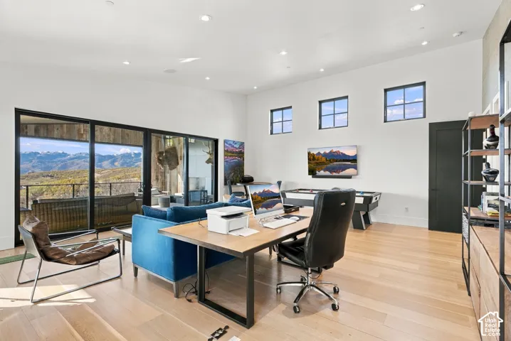 Indoor/outdoor office or bedroom with attached bathroom, floor to ceiling sliding glass doors and views of Park City & Deer Valley