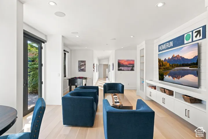 West wing of home featuring wetbar, game room, access to multiple patios and all three multi-level bedrooms