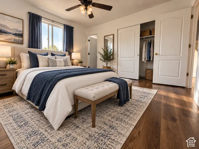 Wood-finish flooring, sliding closet doors, multi-panel interior doors, and a ceiling-mounted light fixture with a fan