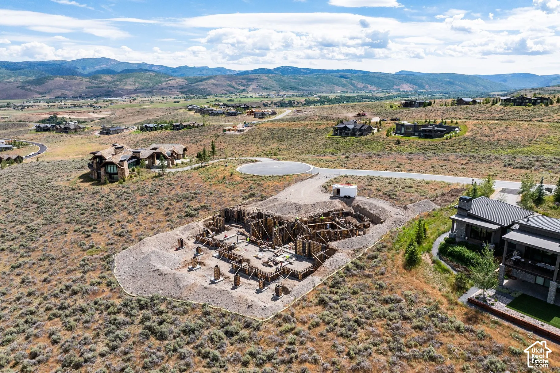 Elevated lot featuring structural foundation framing and expansive mountain scenery