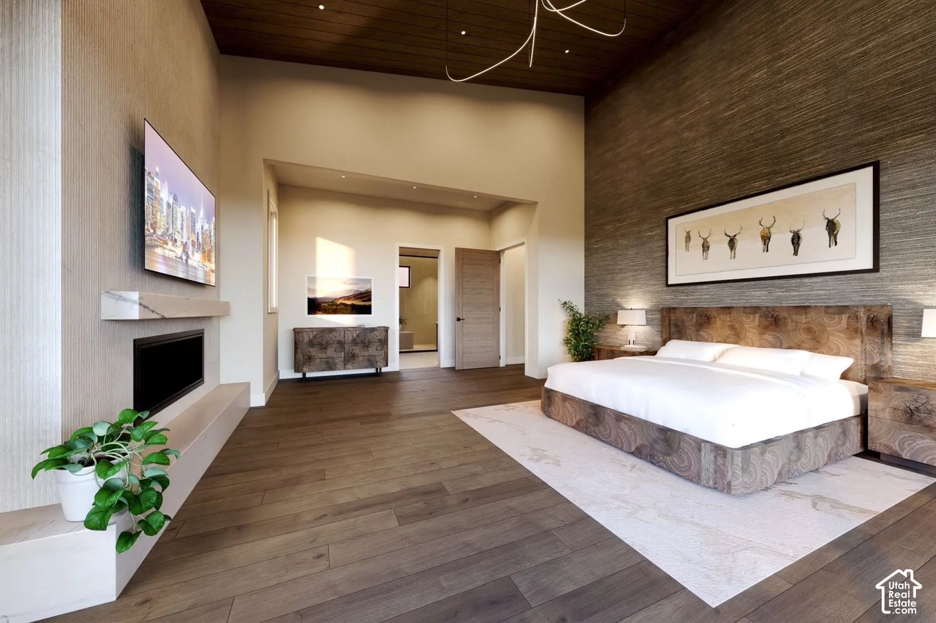 Vaulted ceiling with wood-paneled finish, linear built-in fireplace with stone-style hearth, and textured wall accent