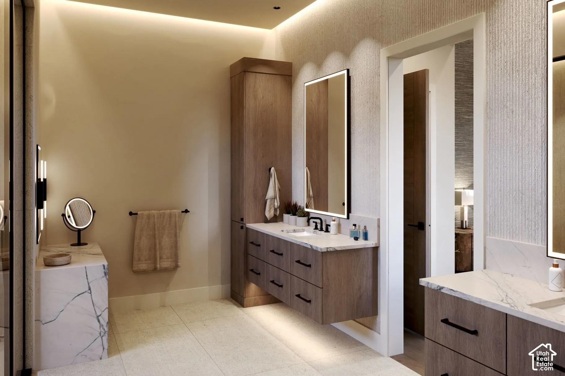 Floating wood-finish vanity with stone countertop, integrated LED-backlit mirror, floor-to-ceiling cabinetry, and neutral tile flooring