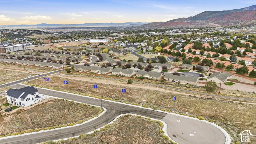 Expansive residential lots featuring paved cul-de-sac access, utility infrastructure, and mountain terrain backdrop
