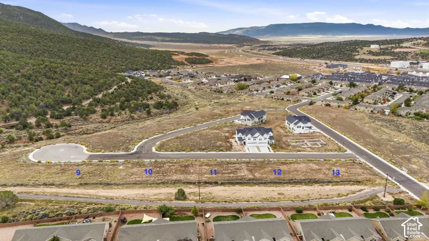 Expansive residential building lots featuring paved road access, utility infrastructure, and mountain topography