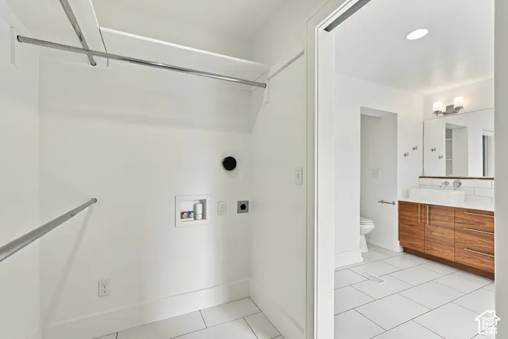 Laundry in primary bedroom closet.