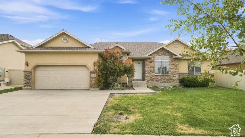 Single-story exterior featuring a stone veneer fa