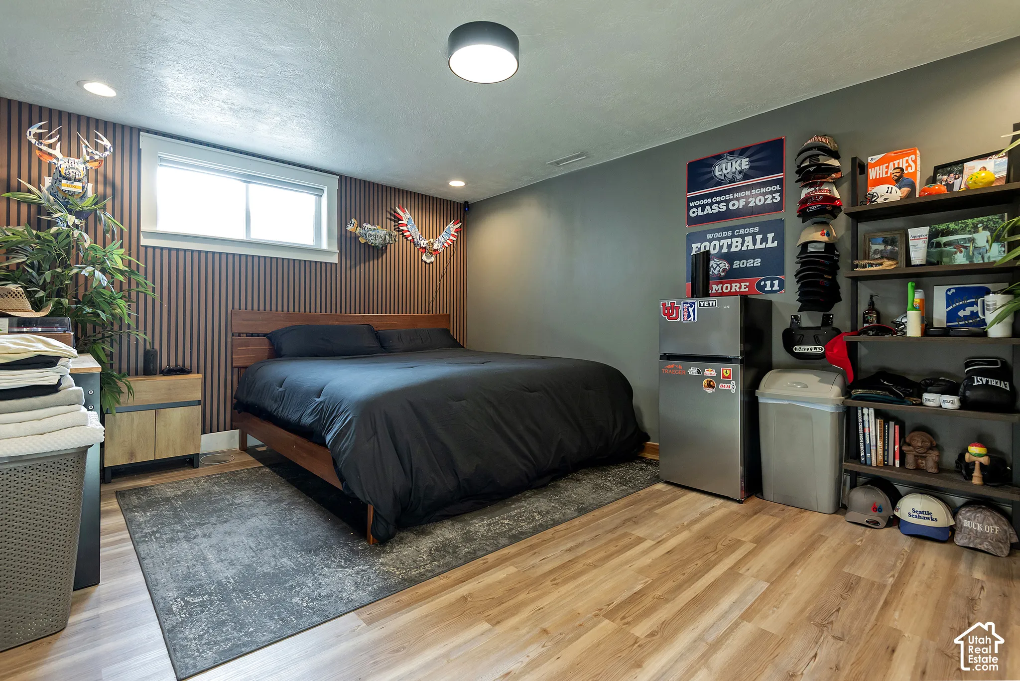 Wood-finish flooring, vertical slat wall treatment, and recessed ceiling lighting