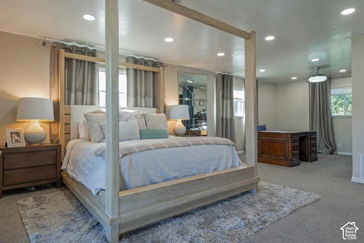 Room featuring recessed lighting, wall-to-wall carpeting, and floor-to-ceiling mirrors