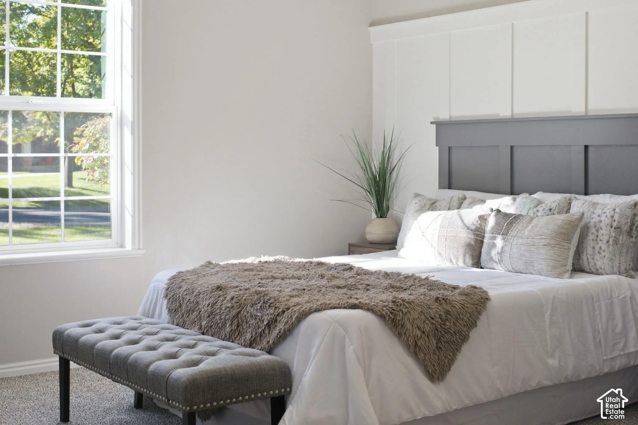 Board-and-batten wall detailing with a contrasting horizontal accent feature and large-pane window