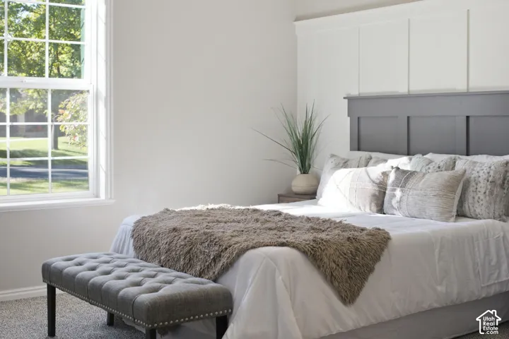 Board-and-batten wall detailing with a contrasting horizontal accent feature and large-pane window