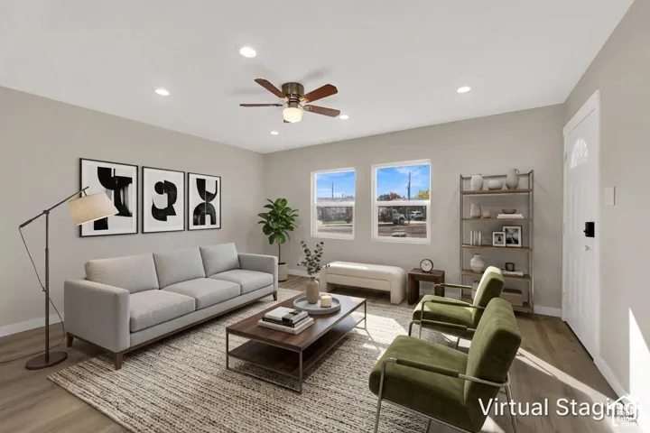 Living area featuring wood-finish flooring, recessed lighting, a ceiling fan, and dual pane windows