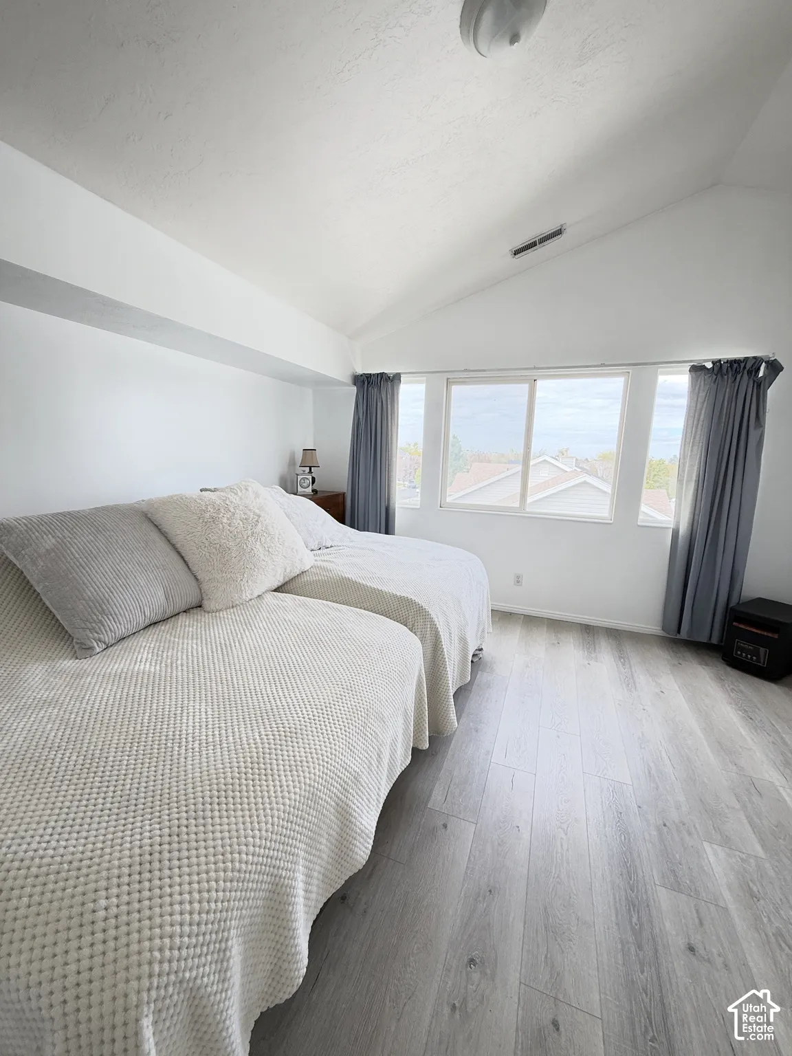 Master Vaulted ceilings, wood-finish flooring, and expansive windows