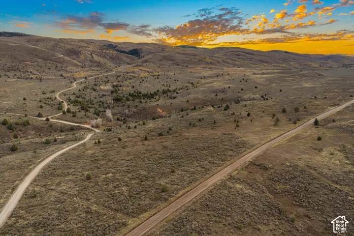 Expansive acreage featuring rolling high-desert terrain, native vegetation, and a private gravel road system