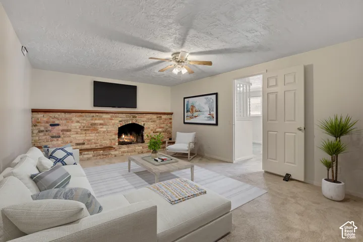 Brick fireplace with wood mantel