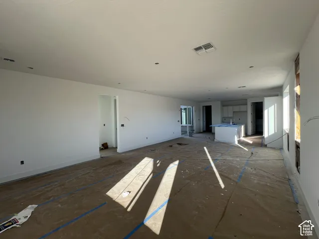 Open-concept interior featuring recessed lighting and a central kitchen island