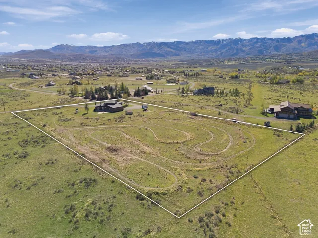 Expansive lot featuring open terrain and mountain backdrops