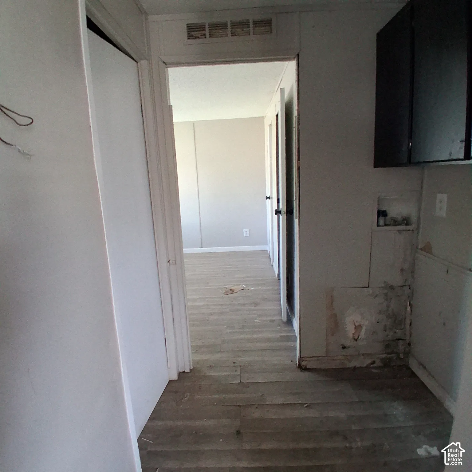 Interior space featuring wood-finish flooring and wall-mounted cabinetry