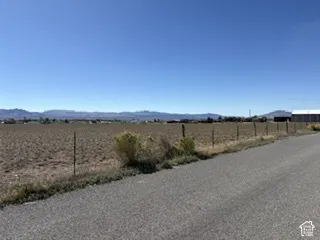 Expansive, level lot featuring mountain terrain and proximity to paved road access