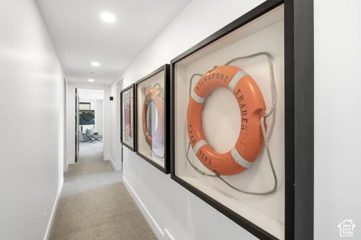 Hallway featuring recessed lighting and wall-to-wall carpeting