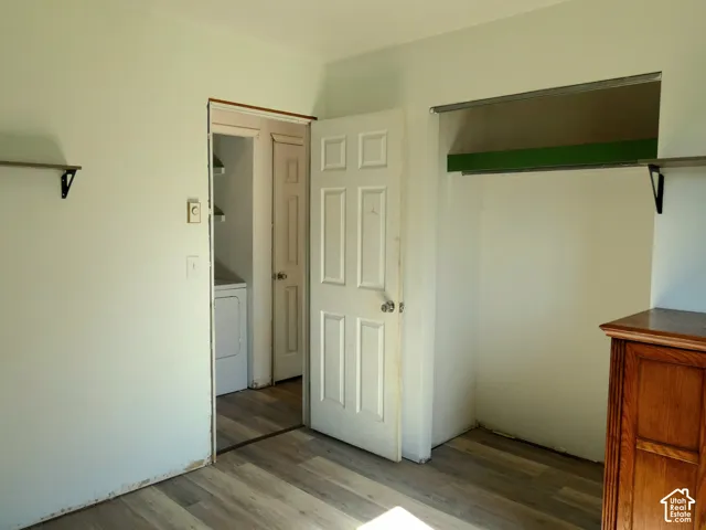 Wood-finish flooring, six-panel interior doors, and built-in closet shelving