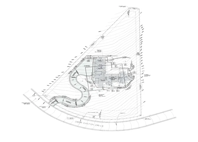 Site Plan. Illustrating the plot boundaries, topography, and the building footprint of the property