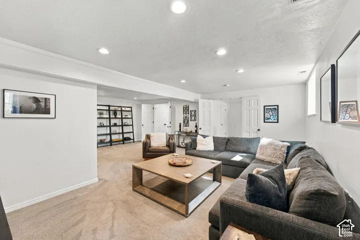 Recessed lighting, wall-to-wall carpeting, neutral interior paint, and six-panel interior doors