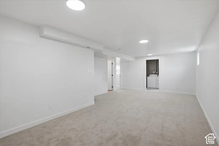 Finished room featuring neutral carpeting, recessed ceiling lighting, and smooth-finish walls