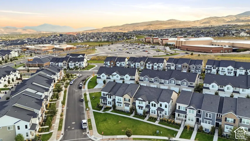 Residential community with a variety of multi-story homes, structured streets, and green spaces