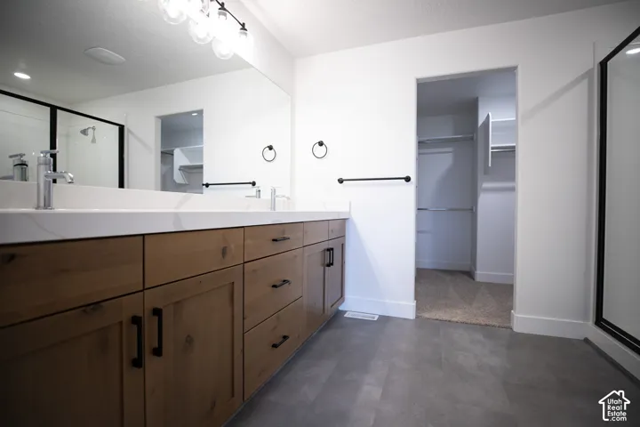 Primary bath with double vanity and large walk-in shower