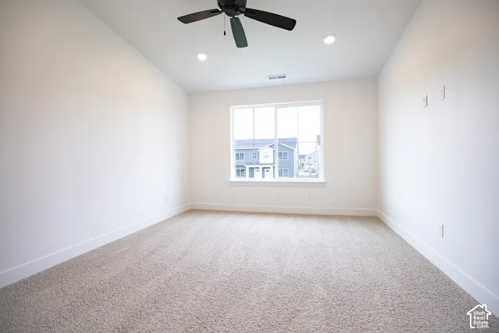 Primary bedroom with vaulted ceilings