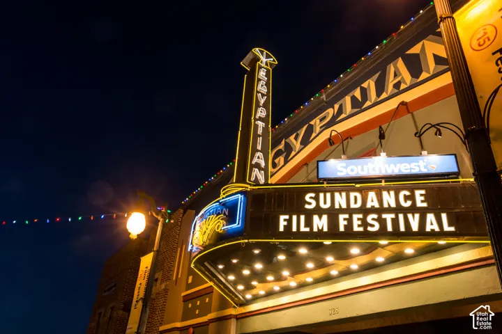 Historic Egyptian Theatre facade featuring architectural marquee detailing, vertical signage, and integrated exterior lighting