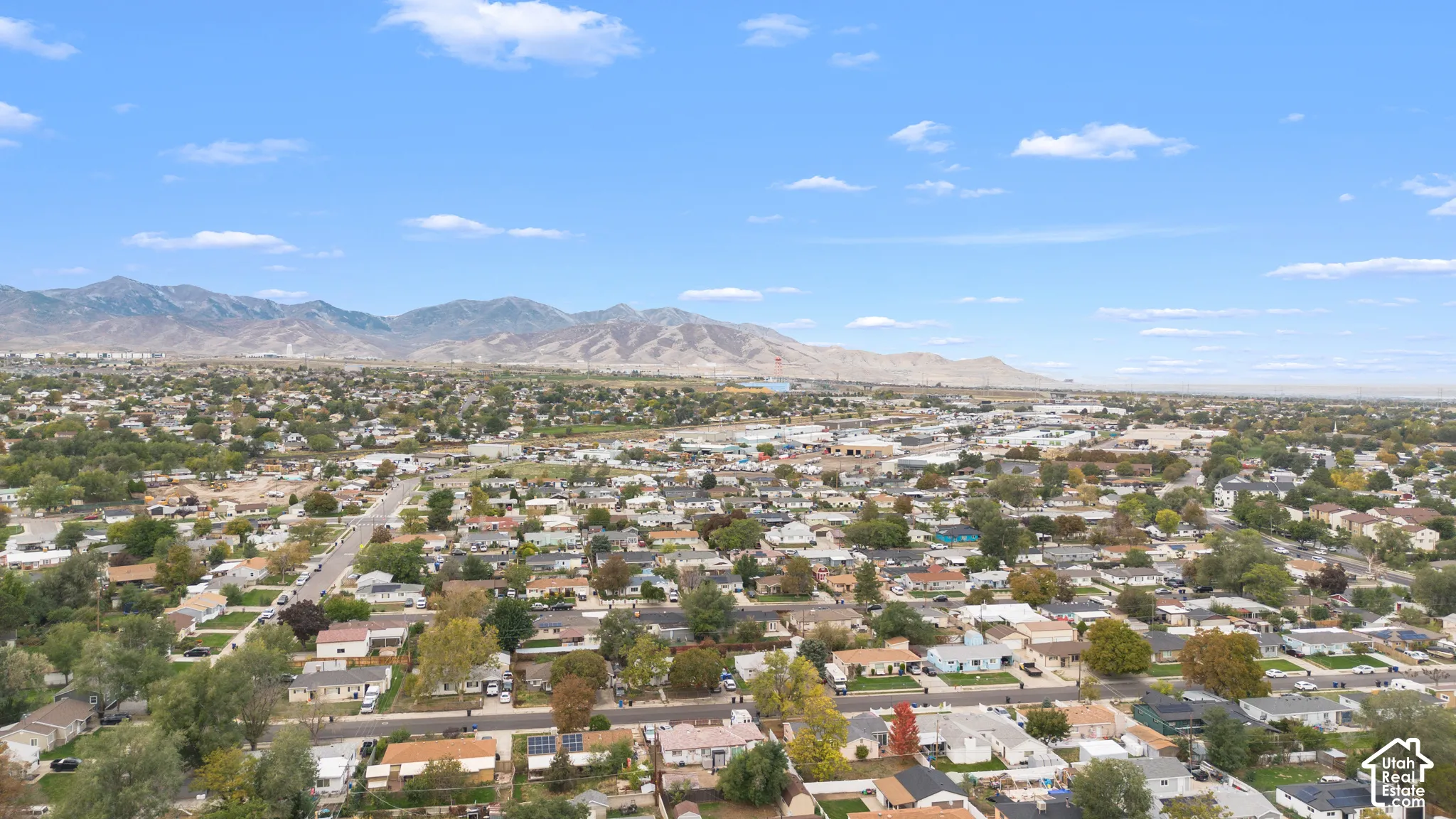 Aerial perspective of the residential area featuring a prominent mountain backdrop
