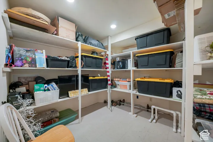 Built-in shelving units featuring multiple tiers and recessed ceiling lighting