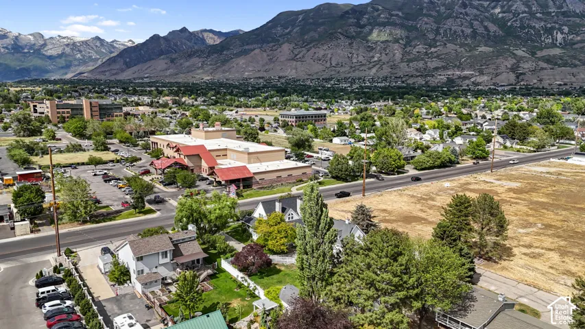 Aerial perspective featuring mountain range scenery and surrounding urban landscape