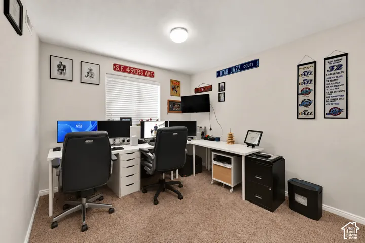 Room featuring neutral wall paint, carpet flooring, a window with horizontal blinds, and a flush-mount ceiling light fixture