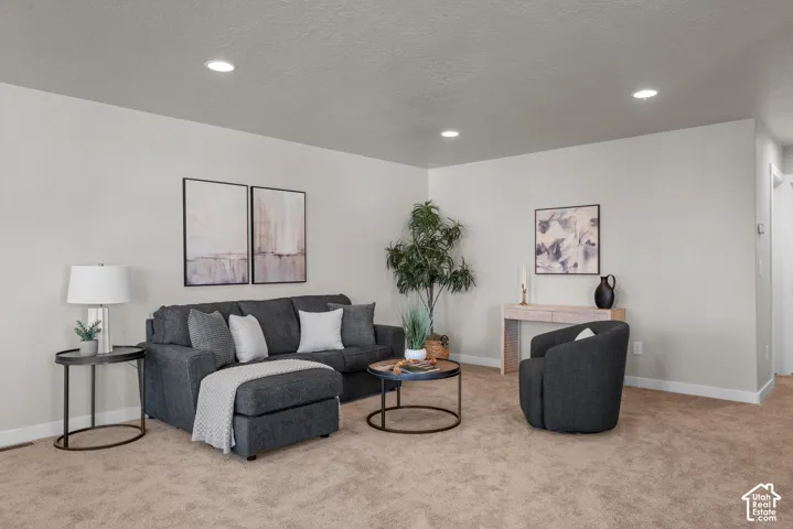 Neutral-toned interior featuring recessed lighting and wall-to-wall carpeting