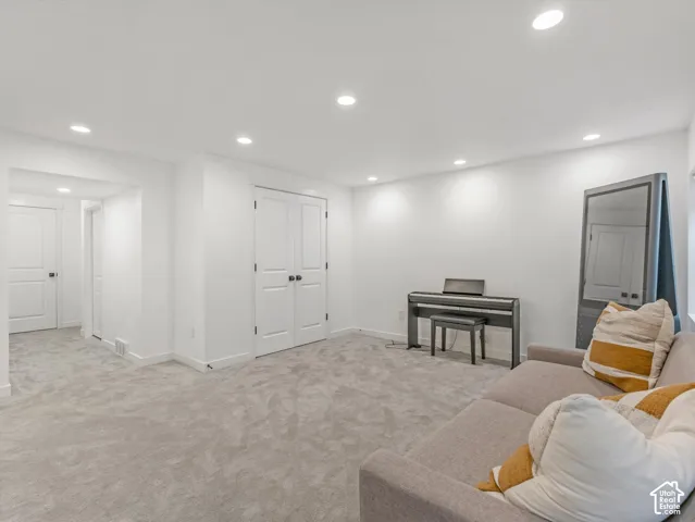 Neutral interior featuring recessed lighting, wall-to-wall carpeting, and double-panel doors
