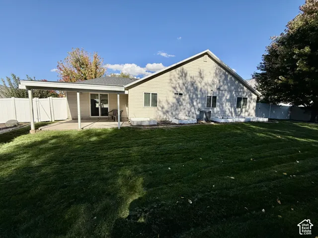 Charming single-story residence with a spacious, level lawn and mature landscaping