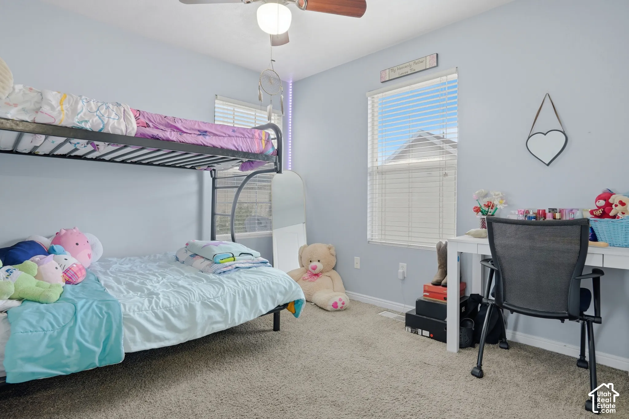 Room featuring neutral wall tones, wall-to-wall carpeting, dual windows with integrated blinds, and a ceiling-mounted light fixture