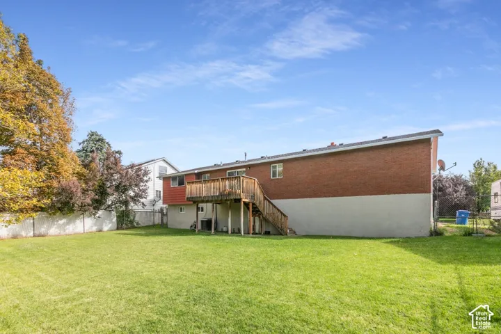Large, flat, fully fenced backyard with a beautiful deck and plenty of room to enjoy.