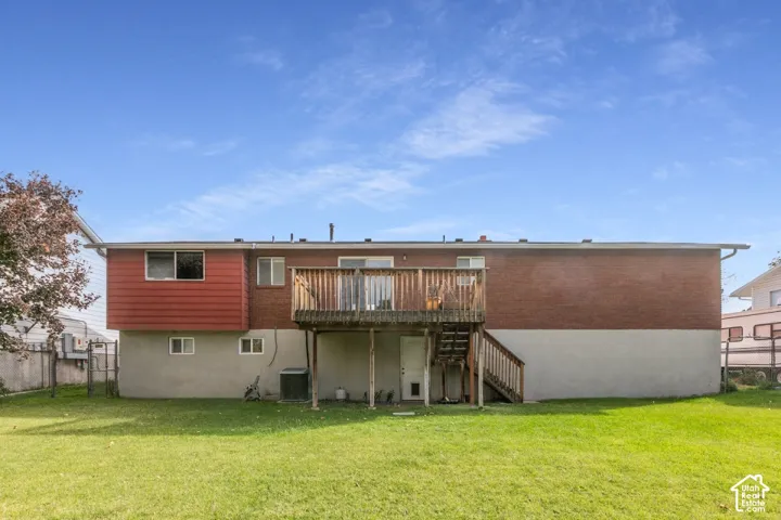 Large, flat, fully fenced backyard with a beautiful deck and plenty of room to enjoy.